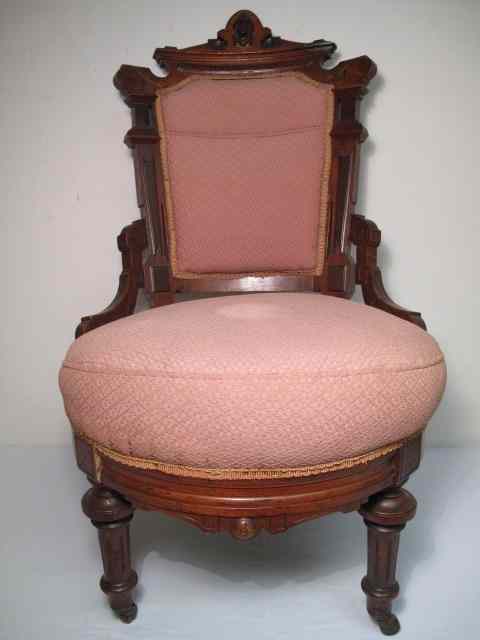 Appraisal: Victorian Eastlake upholstered chair Salmon colored upholstery Carved mahogany design