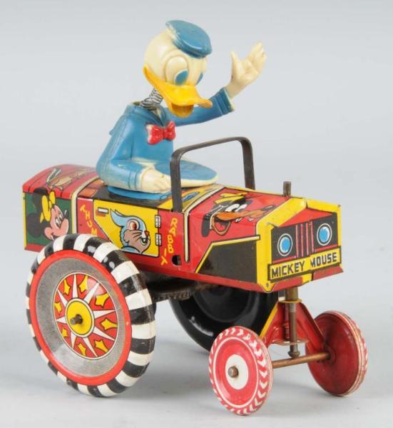 Appraisal: Tin Marx Walt Disney Donald Duck Dipsy Car Toy Description