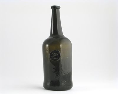 Appraisal: A dark green wine bottle a seal applied to the