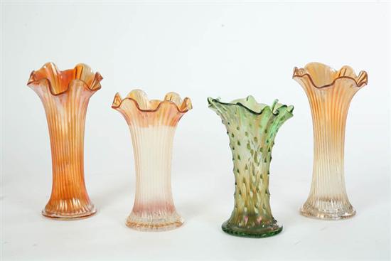 Appraisal: FOUR NORTHWOOD CARNIVAL GLASS VASES Three elongated ribbed vases in