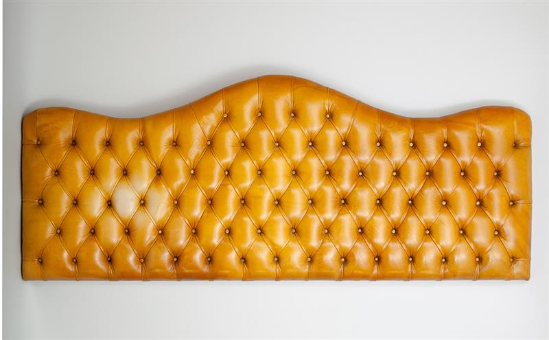 Appraisal: English Tufted Leather King-Sized Headboard With serpentine crest and brass-headed