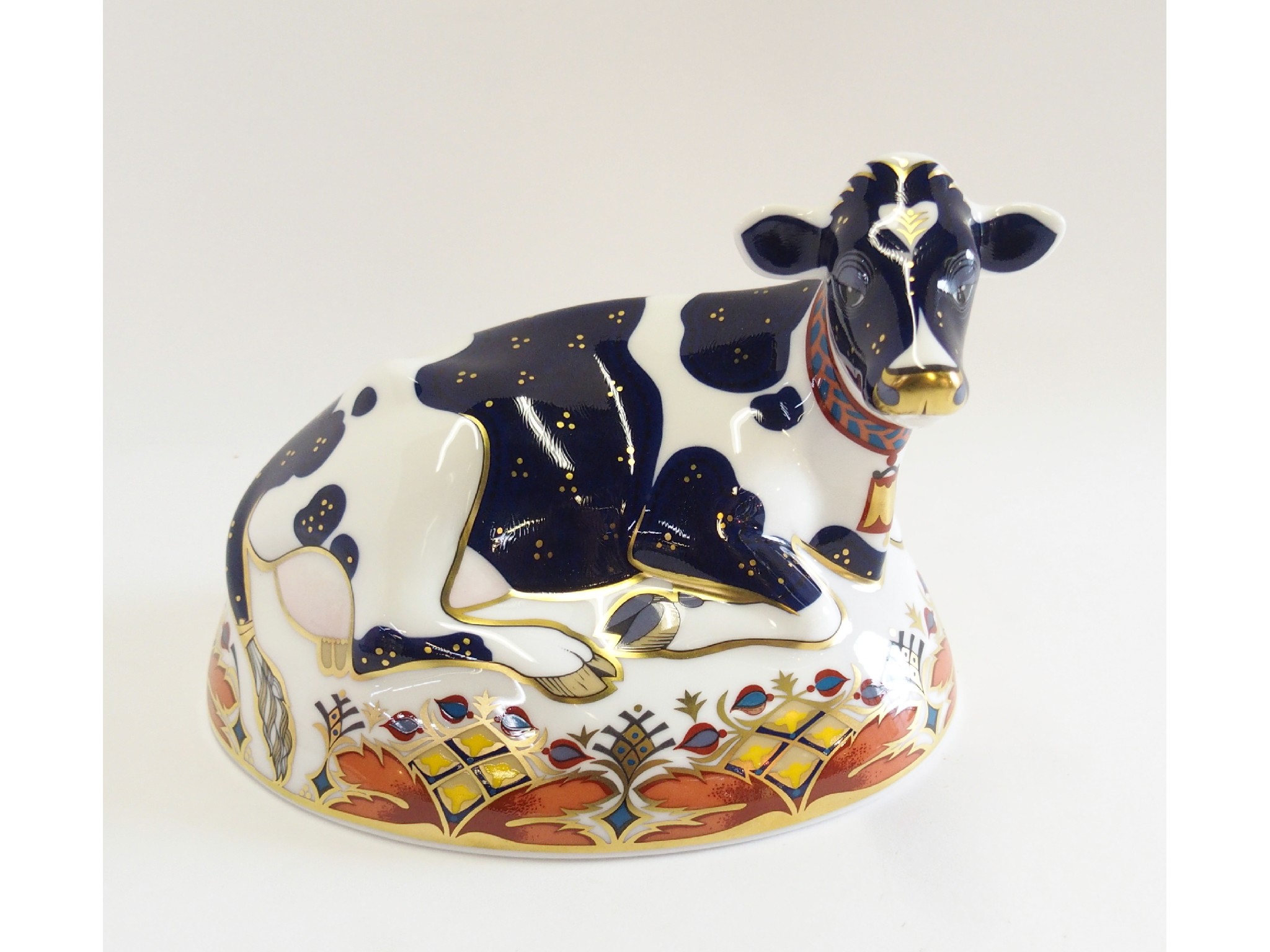 Appraisal: Royal Crown Derby porcelain Friesian Cow Buttercup paperweight