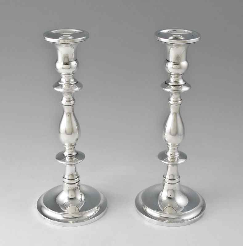 Appraisal: PAIR OF WEIGHTED STERLING CANDLESTICKS Pair single light sticks simply