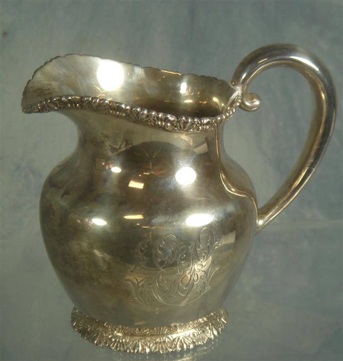 Appraisal: Sterling silver cream pitcher retailed by Bailey Banks and Biddle