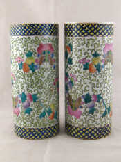 Appraisal: A pair of Chinese ceramic cylinder vases decorated in the