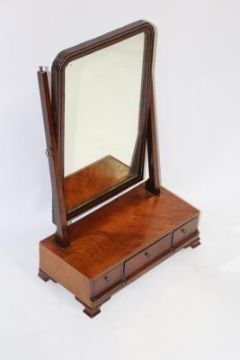 Appraisal: A mahogany swing frame dressing table mirror the base with