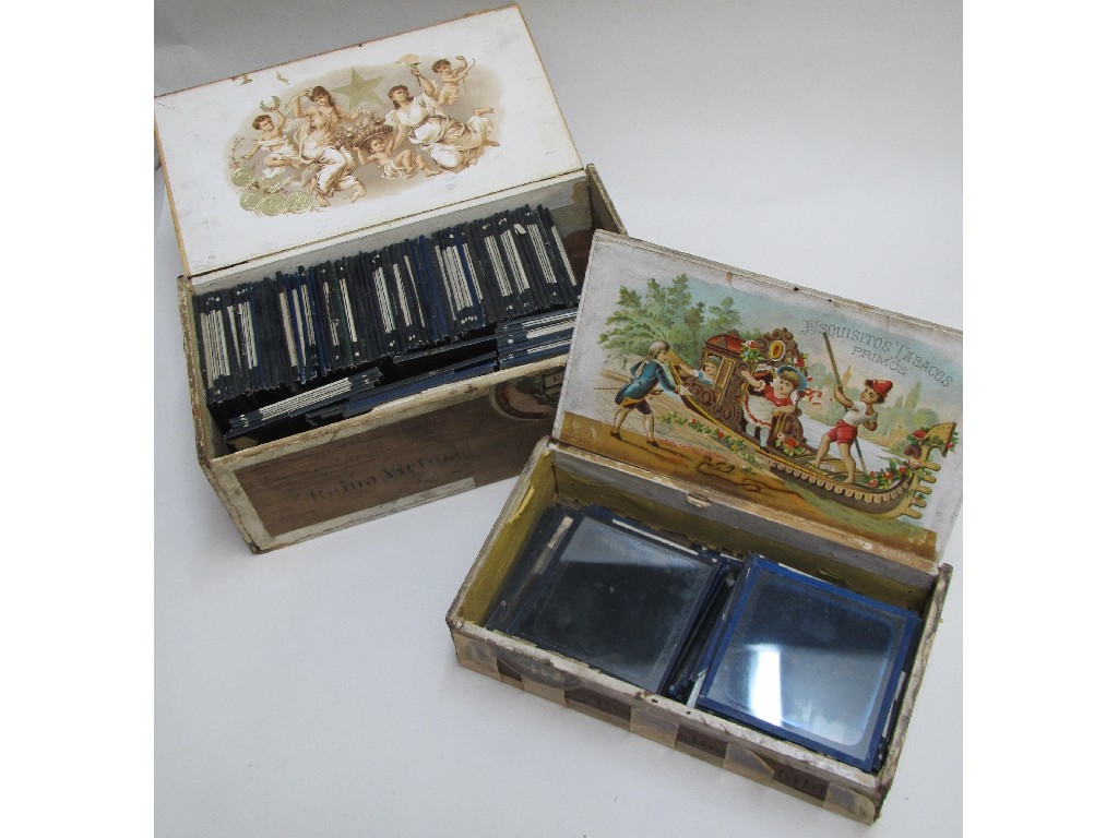 Appraisal: A quantity of photographic glass slides comprising Edwardian family groups