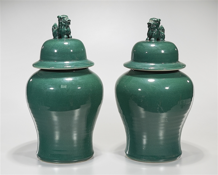 Appraisal: Pair of Chinese green glazed porcelain covered vases lion finials