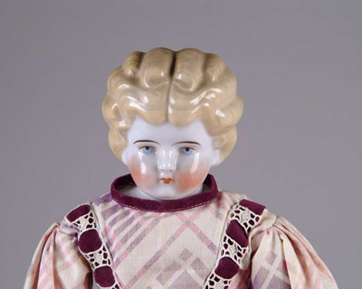 Appraisal: LOT OF CHINA HEAD DOLLS Includes blonde low brow with