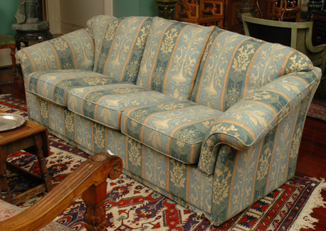 Appraisal: A FLORAL UPHOLSTERED THREE SEATER SETTEE