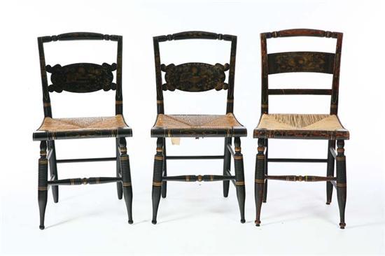 Appraisal: THREE HITCHCOCK CHAIRS Sidechairs with rush seats and painted black