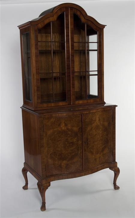 Appraisal: A Queen Anne style walnut display cabinet the arched moulded