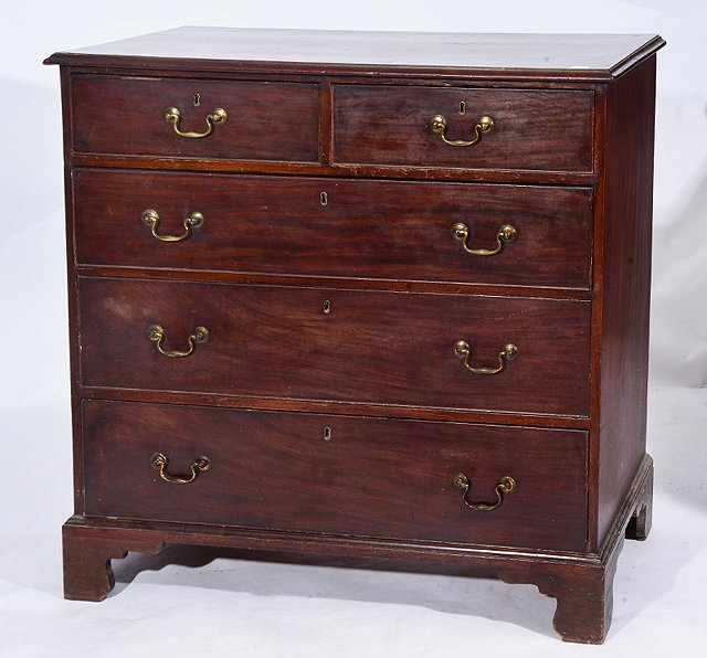 Appraisal: A GEORGE III MAHOGANY STRAIGHT FRONT CHEST of two short