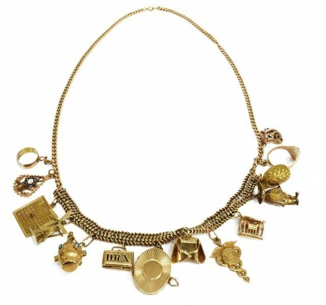 Appraisal: Estate kt yellow gold charm necklace marked M Freed with