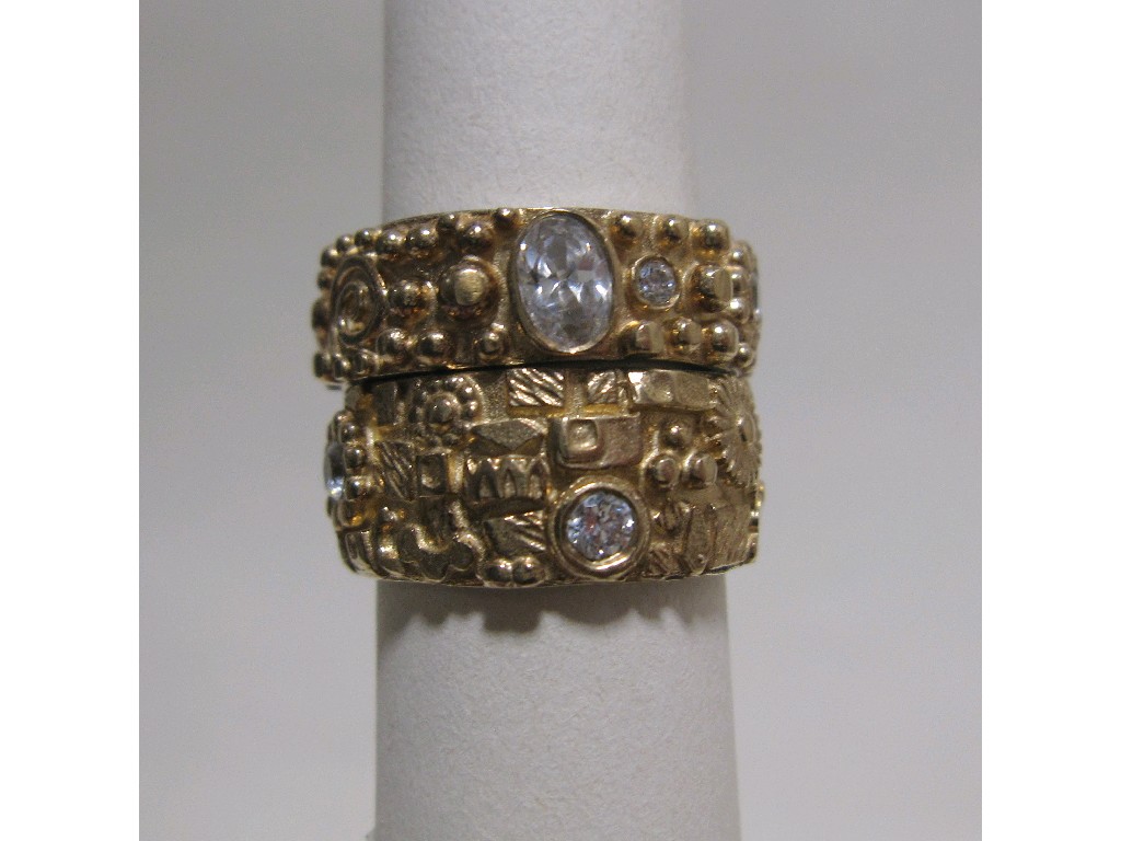 Appraisal: Two silver and gold gem set bands