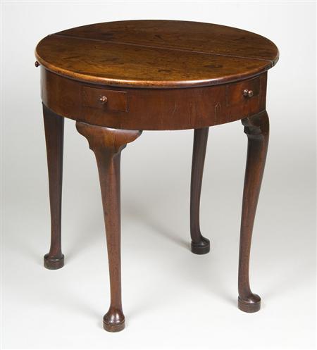 Appraisal: A George II mahogany demi lune tea table circa the