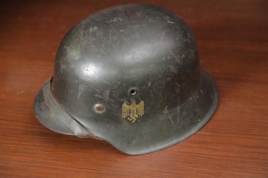 Appraisal: NAZI HELMET Retains leather lining Eagle on left temple Interior