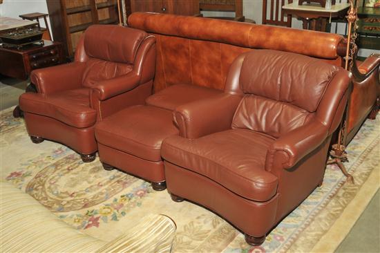 Appraisal: TWO HANCOCK MOORE LEATHER ARMCHAIRS AND OTTOMANS Similar armchairs and