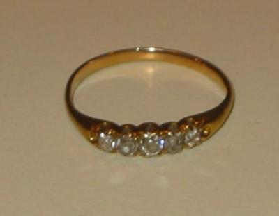 Appraisal: A DIAMOND FIVE STONE RING the old cushion cut stones