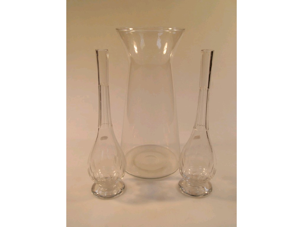 Appraisal: A pair of slender baluster bottle vases with panel cut