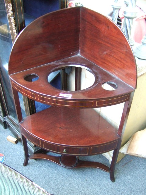 Appraisal: A Regency inlaid mahogany corner washstand the middle tier with