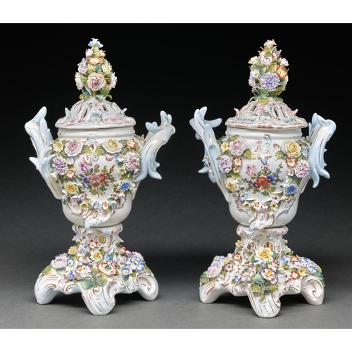 Appraisal: A pair of Sitzendorf floral encrusted rococo pot pourri vases