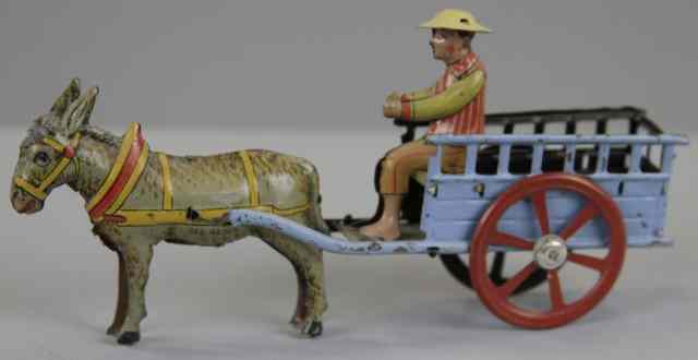 Appraisal: DONKEY DRAWN WAGON WITH DRIVER PENNY TOY Germany attributed to