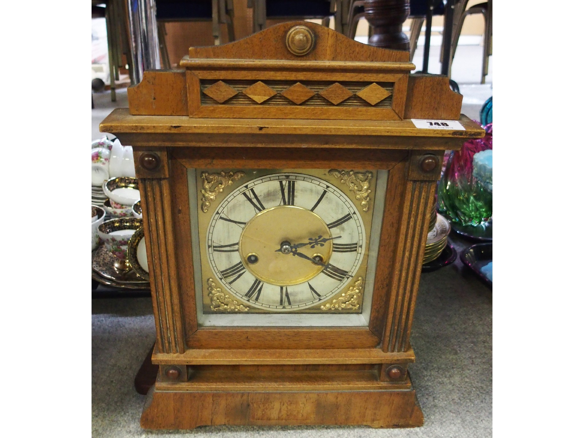 Appraisal: Carved oak mantle clock