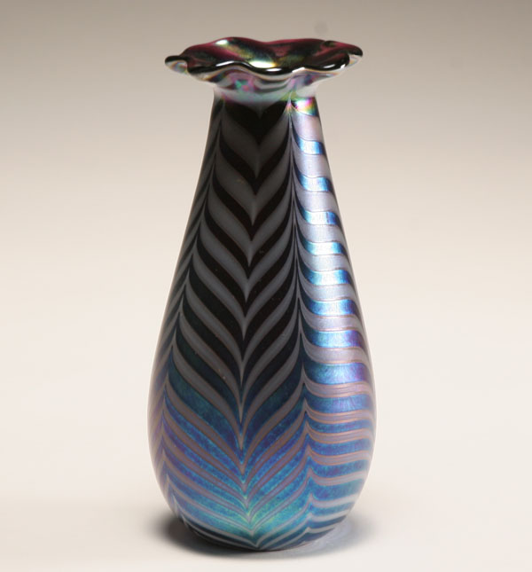 Appraisal: Orient Flume blue iridescent glass vase Ruffled neck having silver