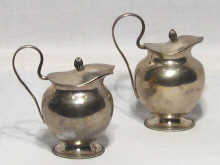 Appraisal: A pair of Austrian silver lidded jugs bearing the Austrian