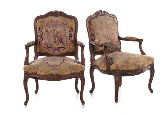 Appraisal: Pair Louis XV style carved fruitwood armchairs late th century