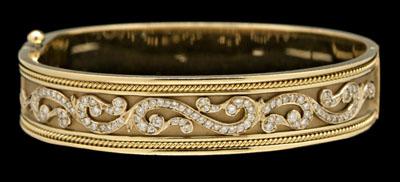 Appraisal: Gold and diamond bangle bracelet kt yellow gold white gold