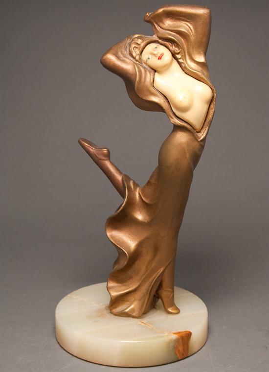 Appraisal: Art Deco gilt-metal and celluloid dancing lady in the manner