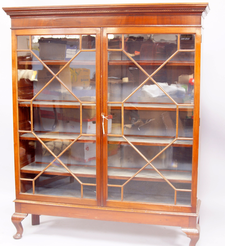 Appraisal: A thC mahogany two door bookcase with dentil moulded cornice