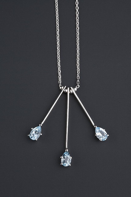 Appraisal: A blue topaz pendant necklace the ct white gold trace-link