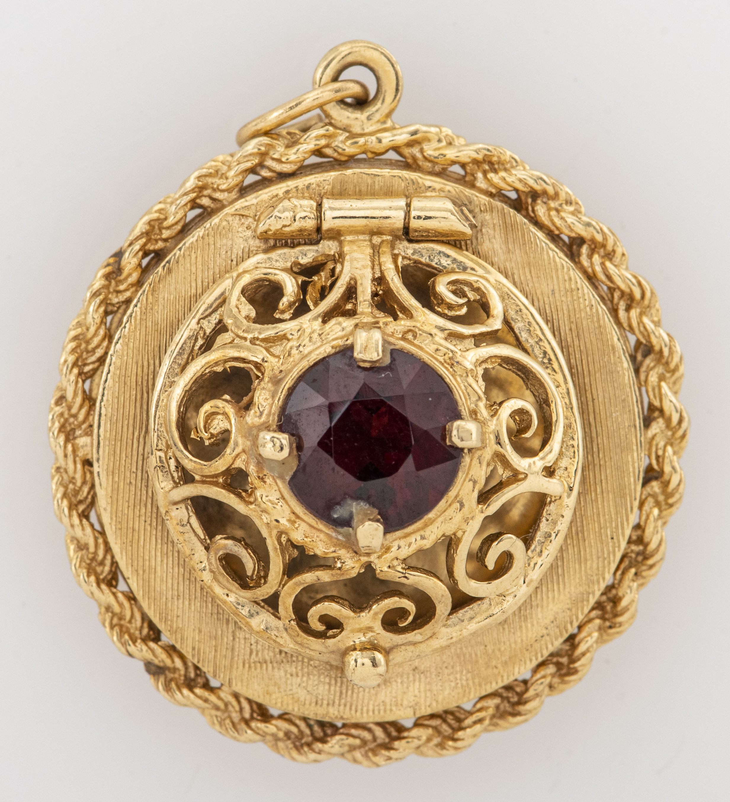 Appraisal: K GOLD GARNET OPEN LATTICEWORK LOCKET PENDANT Vintage K yellow