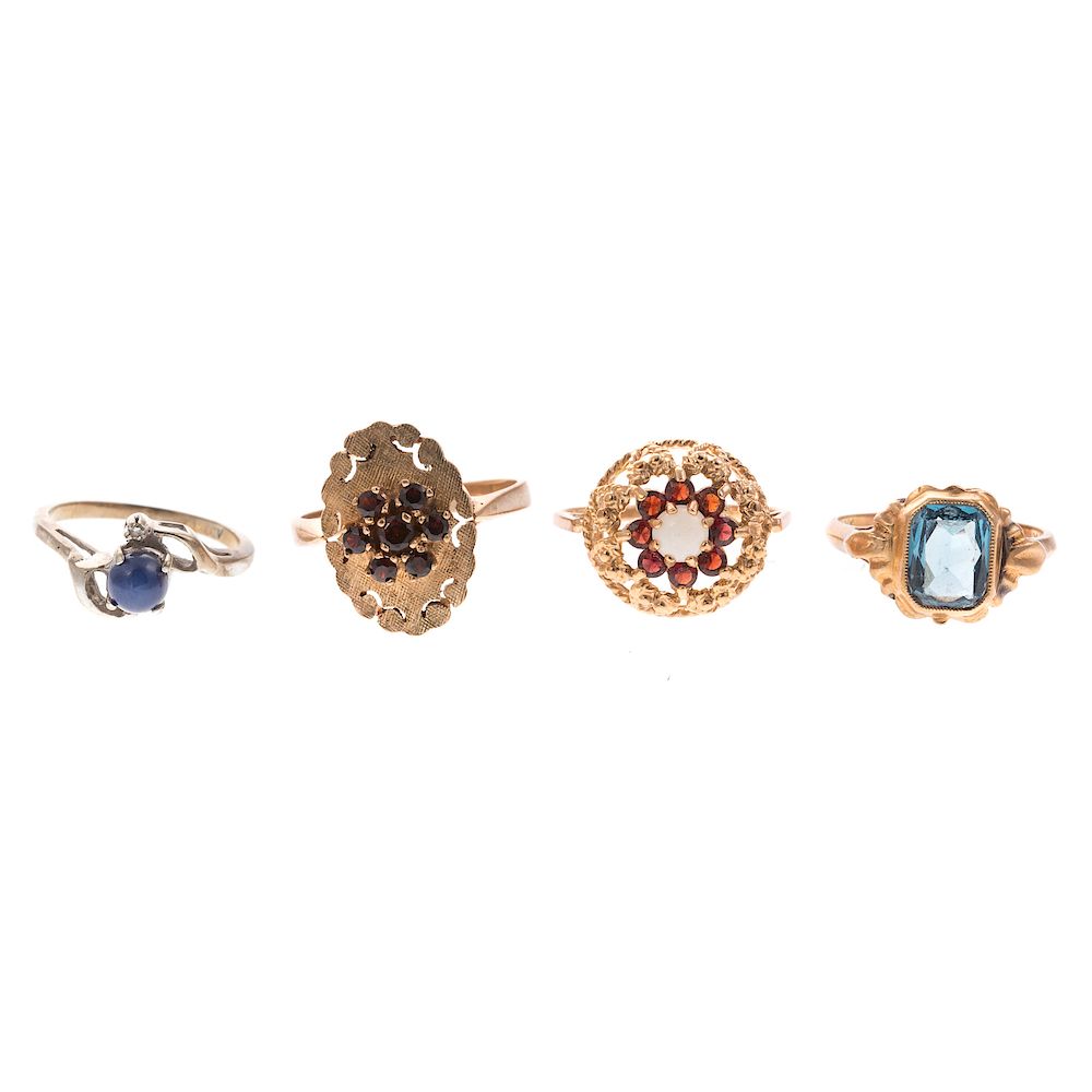 Appraisal: Four Ladies Gemstone Rings in Gold K yellow gold ring