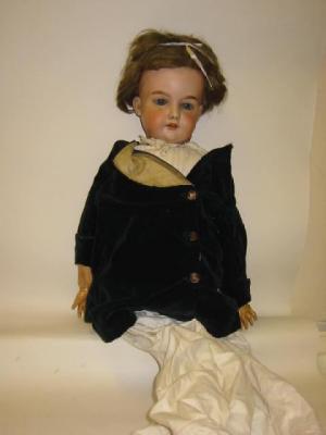 Appraisal: An Armand Marseille bisque head girl doll with blue glass