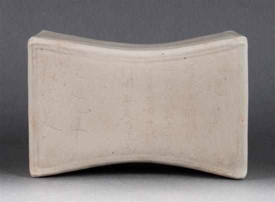 Appraisal: Chinese white-glazed porcelain pillow with incised inscription in H X