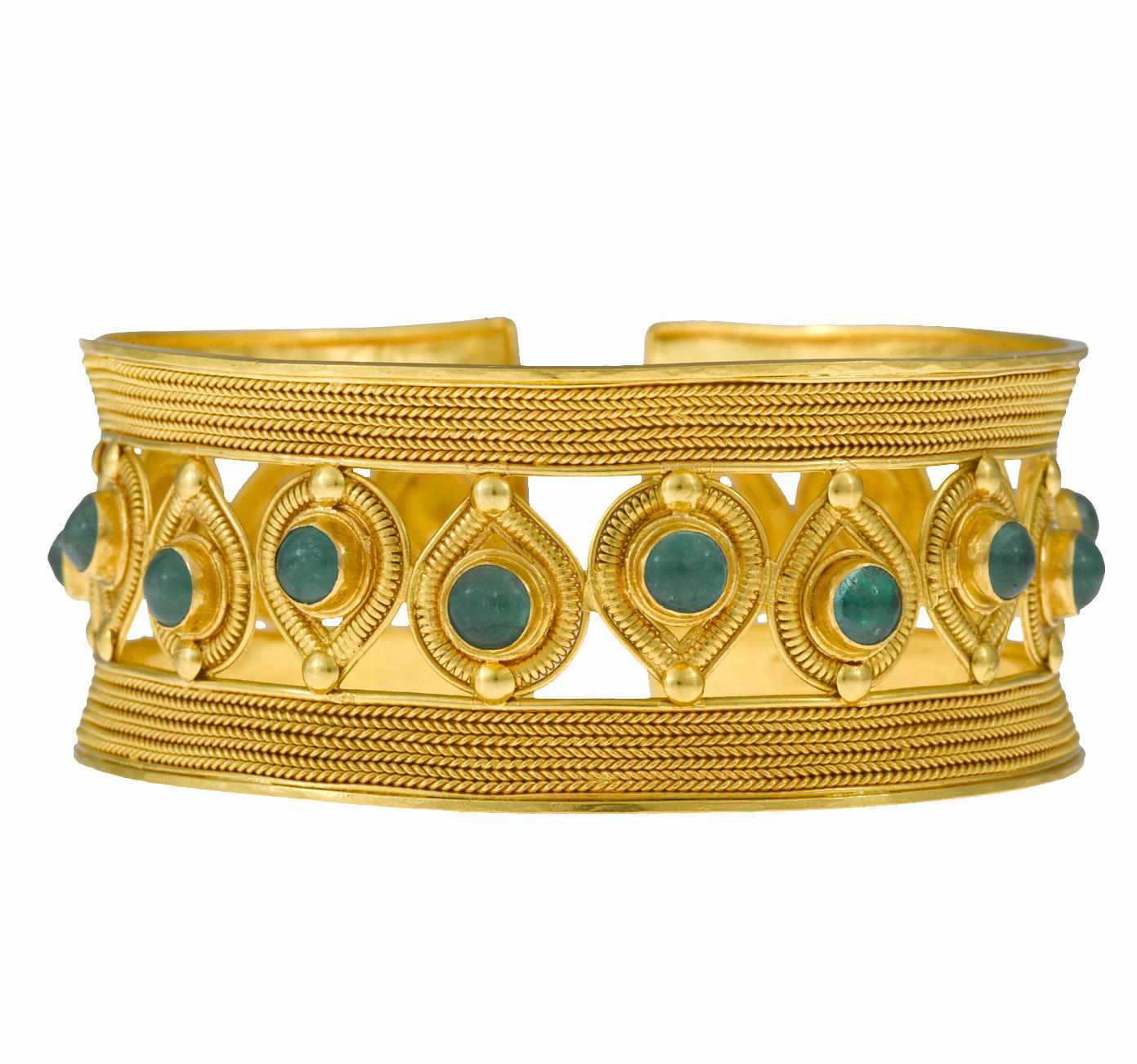 Appraisal: An emerald and twenty-two karat gold cuff bangle bracelet gross