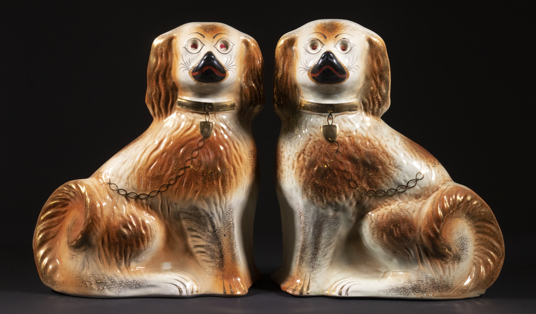 Appraisal: PR STAFFORDSHIRE LUSTRE SPANIEL DOG FIGURINES Matched Pair of Large