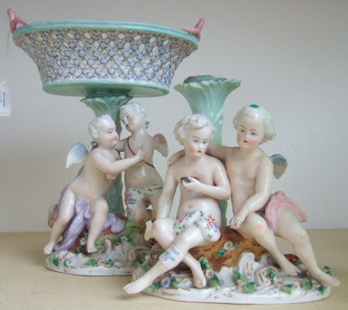 Appraisal: A pair of continental porcelain figural centrepieces late th century