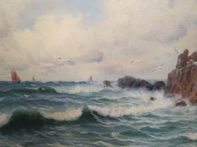 Appraisal: Edward Moore oil rocky coastline with boats in distance on