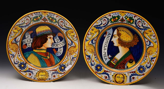 Appraisal: A PAIR OF VOLPI DERUTA MAJOLICA CHARGERS each painted with