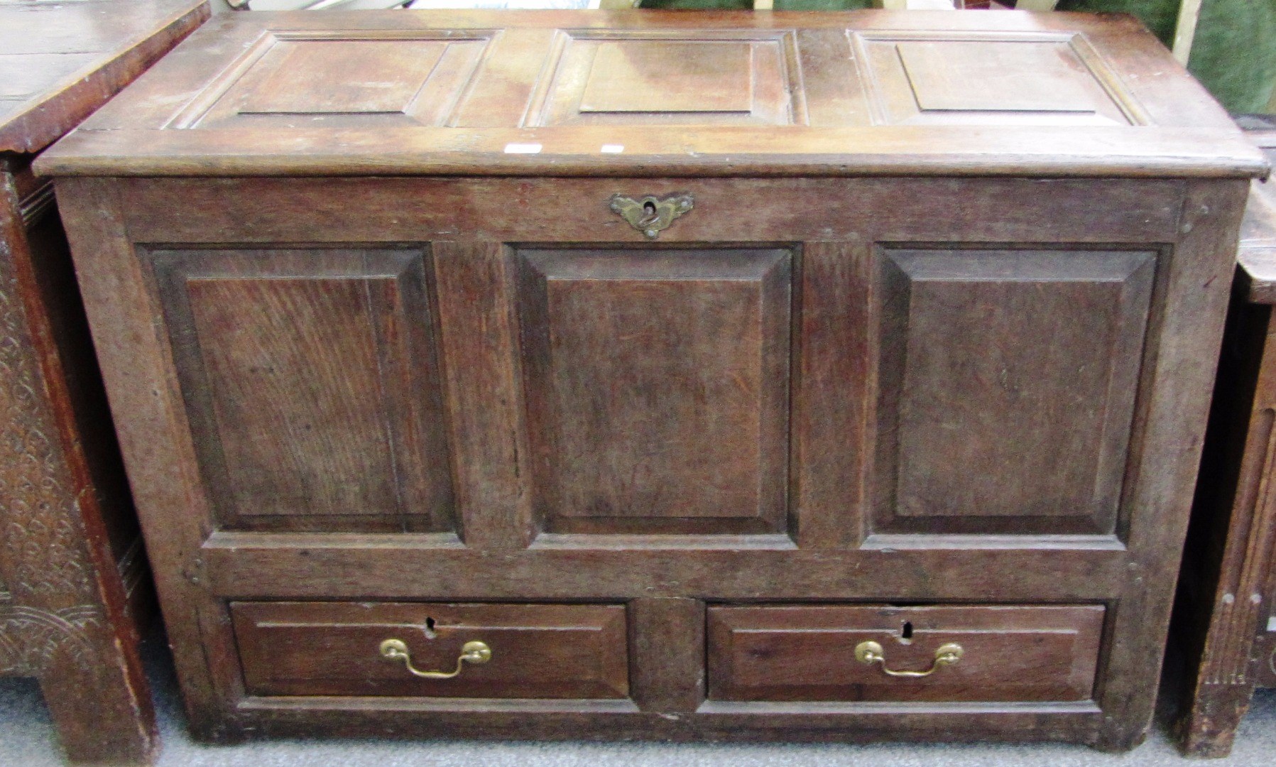 Appraisal: An th century oak mule chest the triple panel top