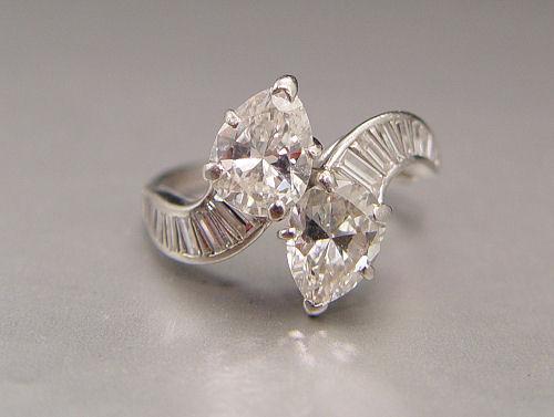 Appraisal: CUSTOM PLATINUM RING FEATURING PEAR SHAPE DIAMONDS Two well matched