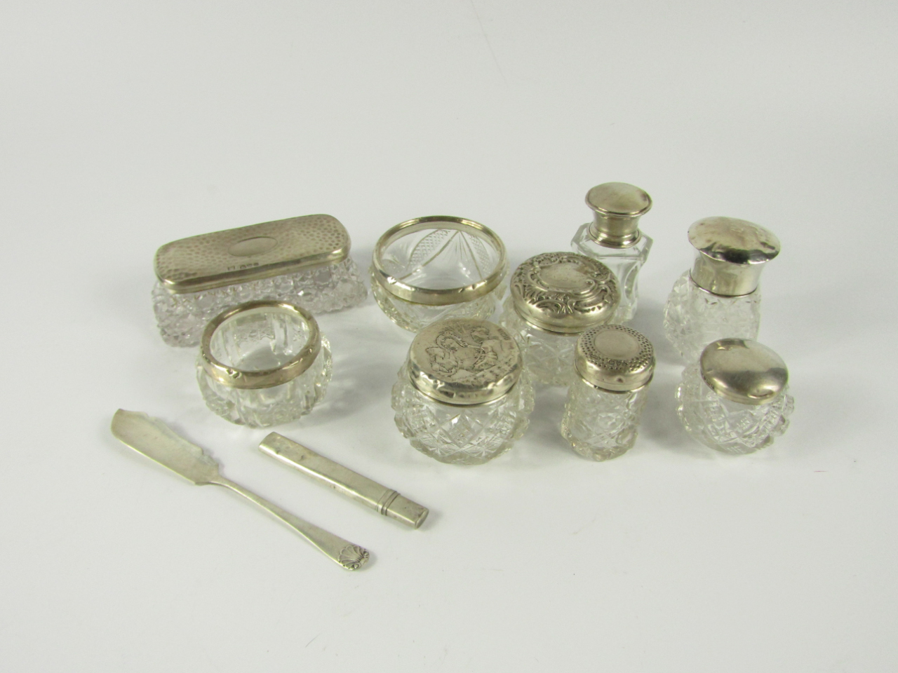 Appraisal: A collection of cut glass toilet jars and scent bottles