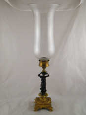 Appraisal: A gilt and bronze candlestick in the form of an