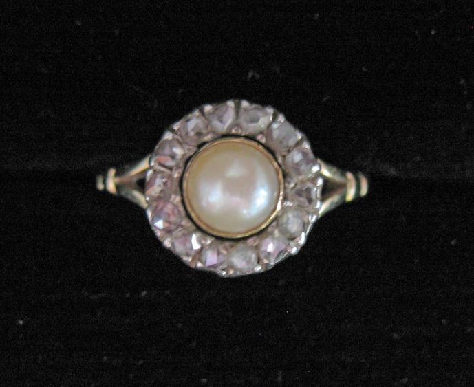 Appraisal: A VICTORIAN DIAMOND AND PEARL CLUSTER RING the central pearl