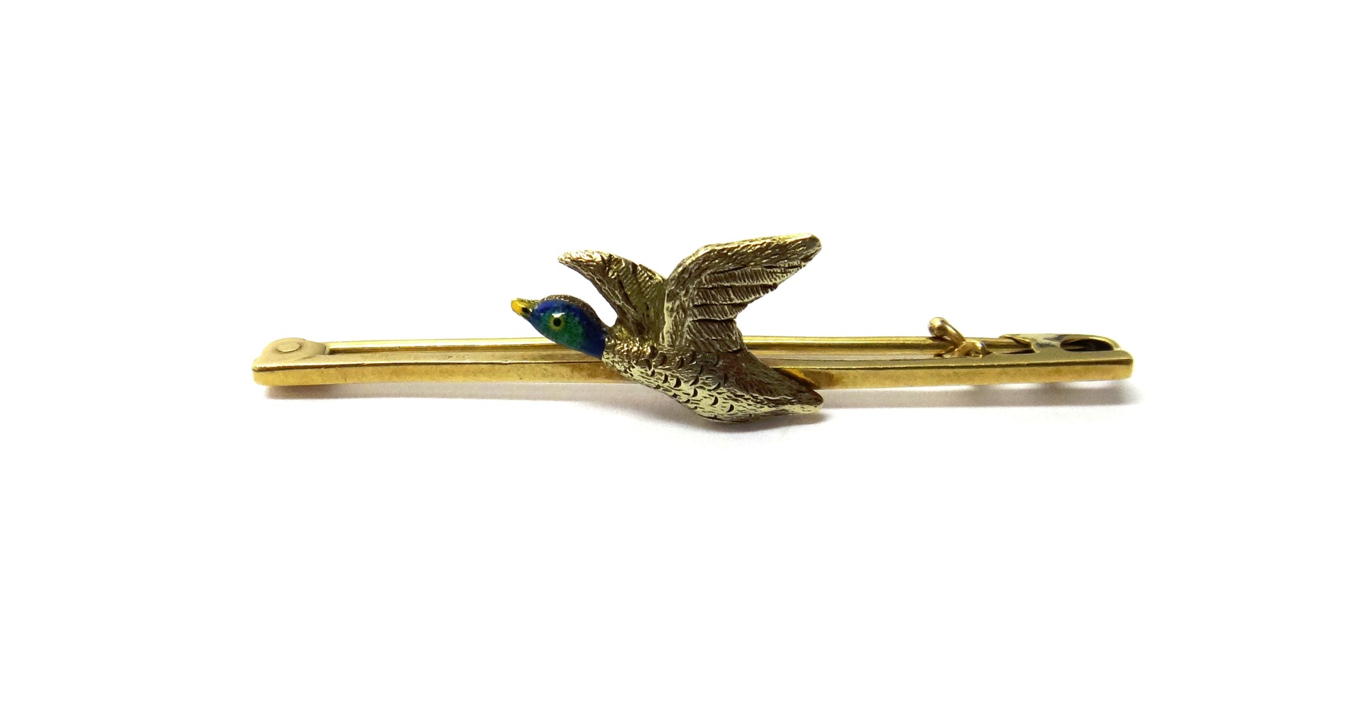 Appraisal: A gold and enamelled bar brooch designed as a duck